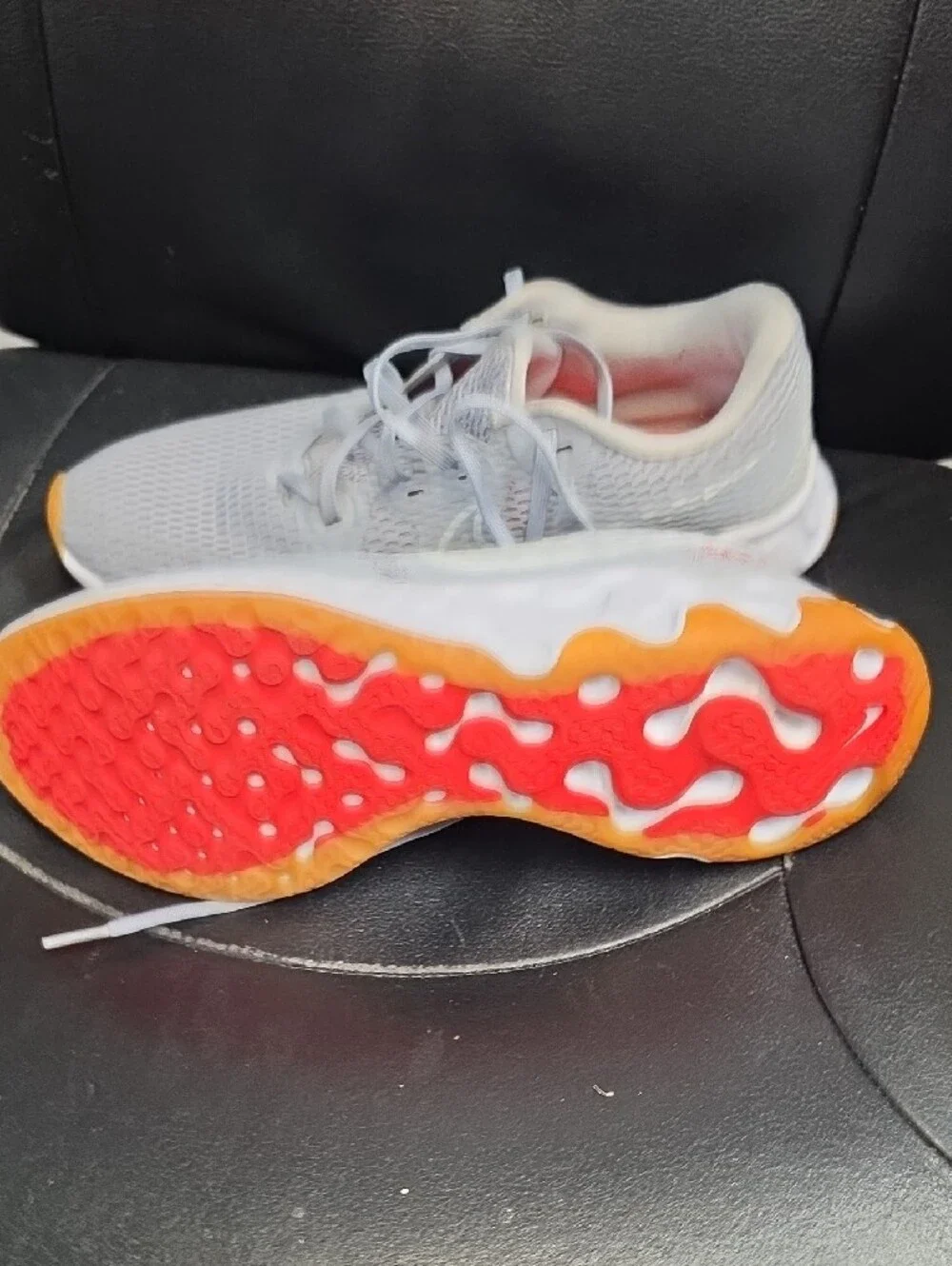 Nike Women's Light Gray Athletic Sneakers with Orange and Red Accents